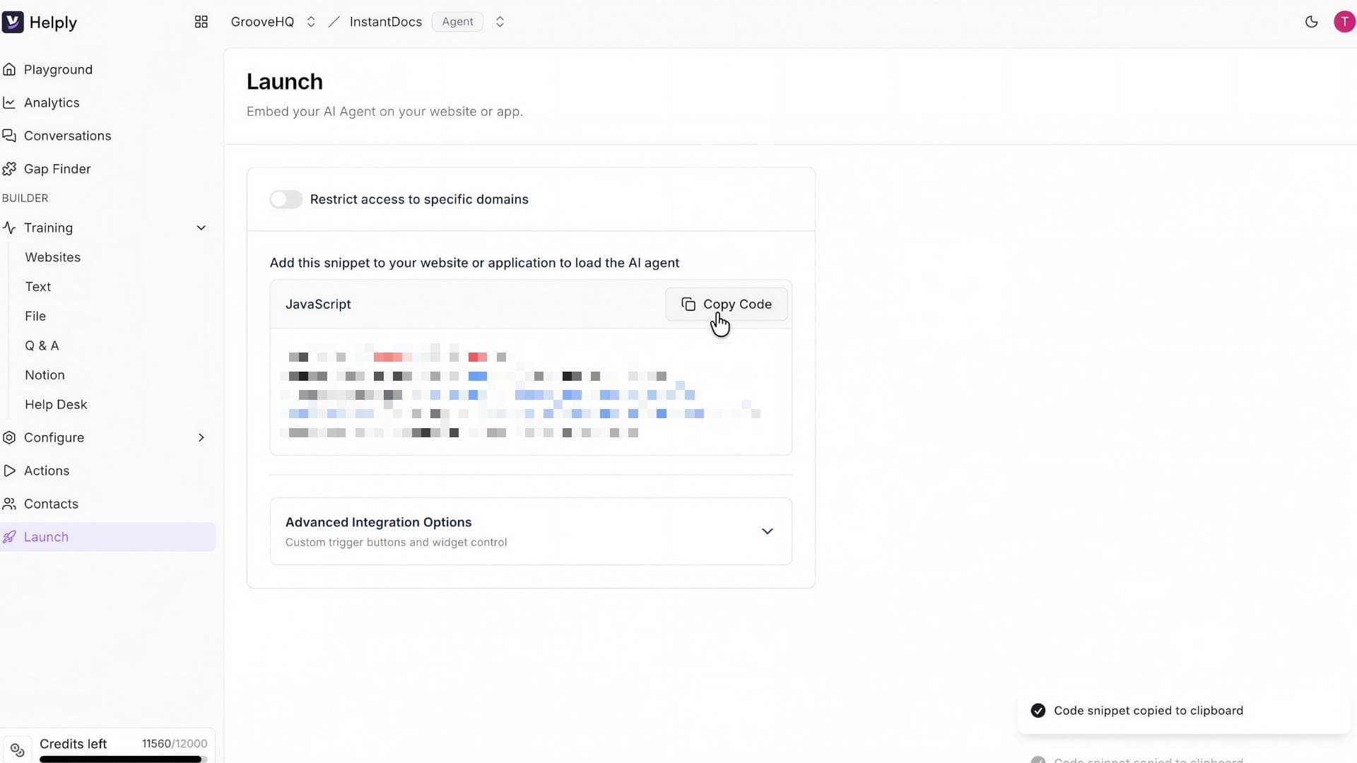 Helply Launch page showing the JavaScript embed code snippet with Copy Code button highlighted, and a confirmation message 'Code snippet copied to clipboard' in the bottom right corner. The page includes options to restrict access to specific domains and advanced integration options for custom trigger buttons.